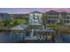 Gorgeous aerial shot showcasing the waterfront home with a pool, private dock, boat lift, and scenic views at 4832 Williams Island Dr., Little River, SC 29566