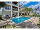 Spacious backyard with a pool, multiple seating areas, an outdoor kitchen, and a view of the waterway at 4832 Williams Island Dr., Little River, SC 29566