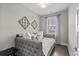 Bedroom with a trundle bed, gray walls, and natural light at 4832 Williams Island Dr., Little River, SC 29566