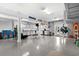 Spacious garage with epoxy flooring, storage cabinets, and room for multiple cars at 4832 Williams Island Dr., Little River, SC 29566