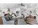 Bright living room featuring neutral furniture and an open floor plan that connects to the kitchen and dining area at 4832 Williams Island Dr., Little River, SC 29566