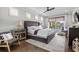 Spacious main bedroom with lake views, a seating area, and a luxurious ensuite bathroom at 4832 Williams Island Dr., Little River, SC 29566
