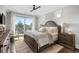 Serene main bedroom with water views, natural light, and neutral decor at 4832 Williams Island Dr., Little River, SC 29566