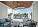 Covered patio with water views, comfortable seating, and an outdoor lounge area at 4832 Williams Island Dr., Little River, SC 29566