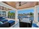 Spacious outdoor patio with comfortable seating, a dining table, and stunning waterfront views, perfect for entertaining at 4832 Williams Island Dr., Little River, SC 29566