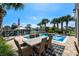 Enjoy the pool area with dining, lounge chairs, and a stunning view of the waterway at 4832 Williams Island Dr., Little River, SC 29566