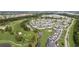 Panoramic aerial view of the community nestled around the golf course, ponds, and lush landscaping at 4879 Dahlia Ct. # 302, Myrtle Beach, SC 29577