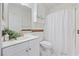 Clean bathroom with a white vanity, decorative mirror, and shower with a curtain at 4879 Dahlia Ct. # 302, Myrtle Beach, SC 29577