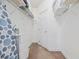 Bright walk-in closet with white shelving, storage, and an ironing board for added convenience at 4879 Dahlia Ct. # 302, Myrtle Beach, SC 29577