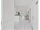 Bright foyer with tiled floor leading to an open living space with hardwood flooring and lots of natural light at 4879 Dahlia Ct. # 302, Myrtle Beach, SC 29577