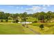 Picturesque golf course view with rolling green hills, mature trees, and tranquil water features at 4879 Dahlia Ct. # 302, Myrtle Beach, SC 29577