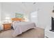 Relaxing main bedroom featuring a wooden headboard, ceiling fan, and bright, airy atmosphere at 4879 Dahlia Ct. # 302, Myrtle Beach, SC 29577