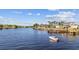 Scenic view of a waterfront with beautiful homes, docks, and a boat on the waterway at 4879 Dahlia Ct. # 302, Myrtle Beach, SC 29577