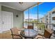 Inviting screened-in balcony with cozy seating overlooking the community at 4895 Luster Leaf Circle # 304, Myrtle Beach, SC 29577