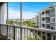 Balcony view of a picturesque community, water feature, and lush landscaping at 4895 Luster Leaf Circle # 304, Myrtle Beach, SC 29577