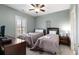 Cozy bedroom features two twin beds, ceiling fan, and bright window views at 4895 Luster Leaf Circle # 304, Myrtle Beach, SC 29577