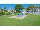 Community BBQ area featuring multiple grills and a picnic table with umbrellas, perfect for outdoor gatherings at 4895 Luster Leaf Circle # 304, Myrtle Beach, SC 29577