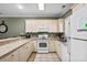 Bright kitchen features ample counter space, modern appliances, and plenty of storage in neutral cabinetry at 4895 Luster Leaf Circle # 304, Myrtle Beach, SC 29577