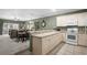 Well-appointed kitchen with breakfast bar extends into dining and living areas creating a cohesive living space at 4895 Luster Leaf Circle # 304, Myrtle Beach, SC 29577
