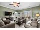 Inviting living room with plenty of seating and a door leading to a private balcony at 4895 Luster Leaf Circle # 304, Myrtle Beach, SC 29577