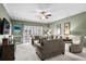 Comfortable living room with a ceiling fan, access to the patio, and neutral tones at 4895 Luster Leaf Circle # 304, Myrtle Beach, SC 29577