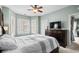 Comfortable main bedroom featuring a ceiling fan, large dresser, and shuttered windows at 4895 Luster Leaf Circle # 304, Myrtle Beach, SC 29577
