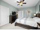 Spacious main bedroom with ceiling fan features dual closets and ensuite bathroom at 4895 Luster Leaf Circle # 304, Myrtle Beach, SC 29577
