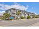 A Place At The Beach is a multifamily residential building with private balconies and mature landscaping at 5001 N Ocean Blvd. # 1F, North Myrtle Beach, SC 29582