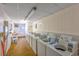 Well-maintained laundry room featuring multiple washing machines and ample lighting at 5001 N Ocean Blvd. # 1F, North Myrtle Beach, SC 29582