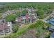 Aerial view of the condo building and surrounding neighborhood with a red location marker at 501 Maison Dr. # G-7, Myrtle Beach, SC 29572