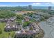 Aerial view of condo community featuring a lagoon with ocean views in the distance at 501 Maison Dr. # G-7, Myrtle Beach, SC 29572