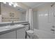 Clean and bright bathroom featuring a vanity, toilet, and shower-tub combination with a white curtain at 501 Maison Dr. # G-7, Myrtle Beach, SC 29572