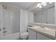 Bright and clean bathroom with a shower-tub combo, white tile floors and white vanity at 501 Maison Dr. # G-7, Myrtle Beach, SC 29572
