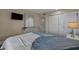 Serene bedroom featuring a large bed, dresser with mirror, and ample closet space at 501 Maison Dr. # G-7, Myrtle Beach, SC 29572
