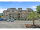 Three-story condo building with wooden balconies, parking, and a well-maintained landscape at 501 Maison Dr. # G-7, Myrtle Beach, SC 29572