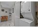 Convenient laundry area with a stackable washer and dryer, adjacent to the kitchen and living spaces at 501 Maison Dr. # G-7, Myrtle Beach, SC 29572