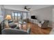 Bright living room with sliding glass doors and cozy seating arrangement at 501 Maison Dr. # G-7, Myrtle Beach, SC 29572