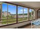 Inviting screened porch with picturesque views of the waterway and mature landscaping at 501 Maison Dr. # G-7, Myrtle Beach, SC 29572