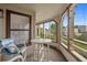 Charming screened porch area with table and chairs, perfect for casual outdoor dining and relaxing at 501 Maison Dr. # G-7, Myrtle Beach, SC 29572