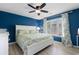 Beautiful bedroom with blue accent wall, ceiling fan, and lots of natural light at 507-C 2Nd Ave. N, North Myrtle Beach, SC 29582