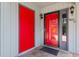 Close up of entryway with a red front door and security system at 507-C 2Nd Ave. N, North Myrtle Beach, SC 29582