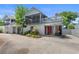 Inviting two-story beach house with a screened porch and covered parking at 507-C 2Nd Ave. N, North Myrtle Beach, SC 29582