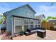 Rear exterior view of home showing deck and sunroom at 507-C 2Nd Ave. N, North Myrtle Beach, SC 29582