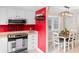 Updated kitchen with stainless steel appliances and vibrant red accents at 507-C 2Nd Ave. N, North Myrtle Beach, SC 29582