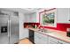 Kitchen area with modern stainless-steel refrigerator and ample countertop space at 507-C 2Nd Ave. N, North Myrtle Beach, SC 29582