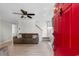 Cozy living room featuring a ceiling fan, fireplace and a staircase at 507-C 2Nd Ave. N, North Myrtle Beach, SC 29582