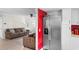 Open floorplan view of living room, staircase and the stainless steel refrigerator at 507-C 2Nd Ave. N, North Myrtle Beach, SC 29582