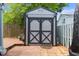 Well maintained storage shed in a private fenced backyard with mature trees at 507-C 2Nd Ave. N, North Myrtle Beach, SC 29582