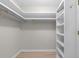 Spacious walk-in closet with built-in shelving and wood-look floors for ample storage at 507-C 2Nd Ave. N, North Myrtle Beach, SC 29582