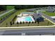 An aerial image of a sparkling pool, featuring a modern clubhouse with green space at 564 Strawberry Field Way, Galivants Ferry, SC 29544